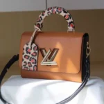 Vuitton Twist Lock Brown Handbag